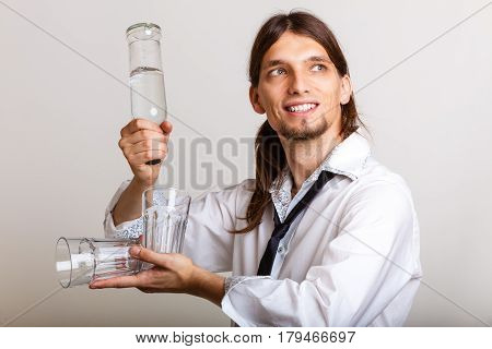 Bartender Fills Glass From Bottle.