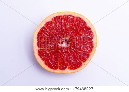 Half A Fresh Red Grapefruit On White Background