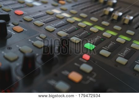 Music equipment closeup. Management console sound design at the event. Big black mixer with control knobs.
