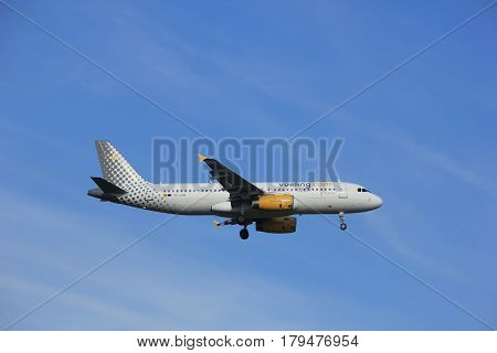 Amsterdam the Netherlands - July 21st 2016:EC-LUN Vueling Airbus A320 approaching Polderbaan runway at Schiphol Amsterdam Airport arriving from Naples