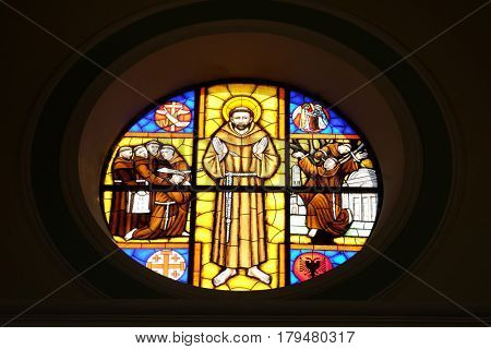 SHKODER, ALBANIA - SEPTEMBER 30: Saint Francis of Assisi, stained glass window in St Stephen's Cathedral in Shkoder, Albania on September 30, 2016.