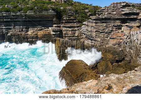 Mountain Cliff And Powerful Ocean Waves