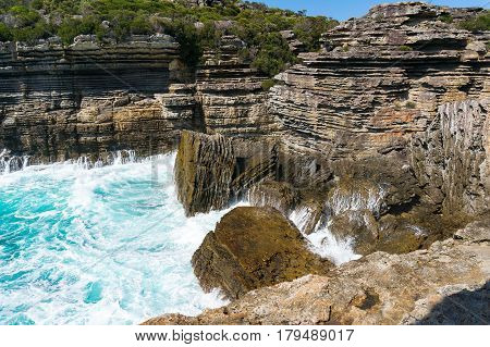 Mountain Cliff And Powerful Ocean Waves