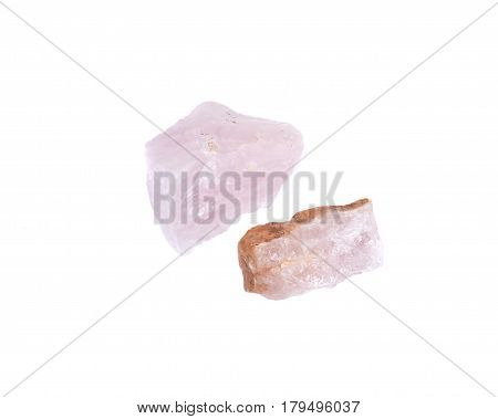 Rose quartz chunks from Madagascar isolated on white background