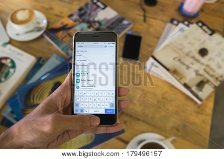 CHIANGMAI THAILAND - JAN 262017:iPhone open Twitter application and searching Twitter is an online social networking and microblogging service that enables users to send and read 