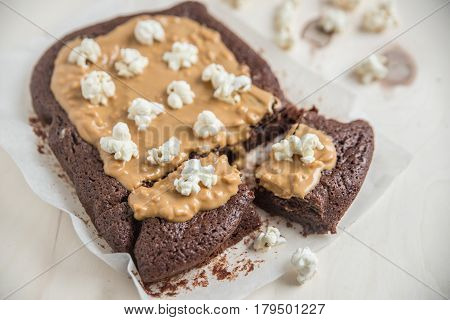 Chocolate Brownies with peanut butter topping and popcorn
