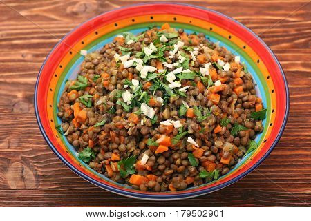 Lentil with carrot and onion in bowl. Healthy lifestyle. Diet menu.