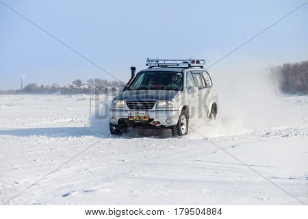 KHABAROVSK RUSSIA - JANUARY 28 2017: Suzuki Escudo riding on snow during local championship