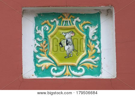 MYSHKIN, RUSSIA - JULY 13, 2016: The mouse plays the accordion. Tiled floor in the design of the Palace of the Mouse close up