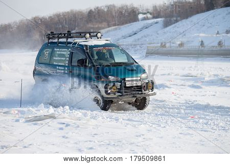 KHABAROVSK RUSSIA - JANUARY 28 2017: Mitsubishi Delica riding on snow during local championship