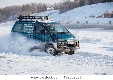 KHABAROVSK RUSSIA - JANUARY 28 2017: Mitsubishi Delica riding on snow during local championship