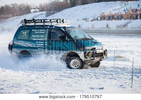 KHABAROVSK RUSSIA - JANUARY 28 2017: Mitsubishi Delica riding on snow during local championship