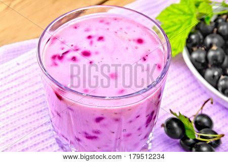 Milkshake With Black Currants In Glass On Wooden Board