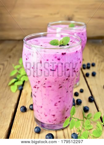 Milkshake With Blueberries In Two Glasses On Board