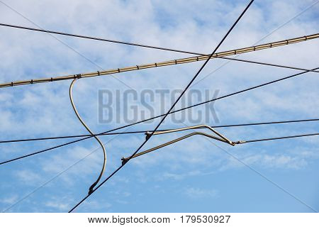 Streetcars or tram electric wires close up.