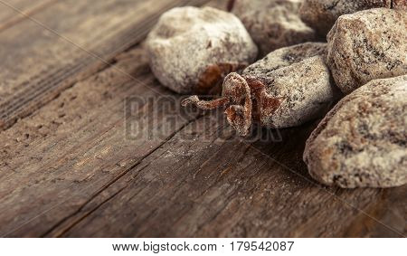 Dried persimmon fruits on wooden background. Oriental sweets