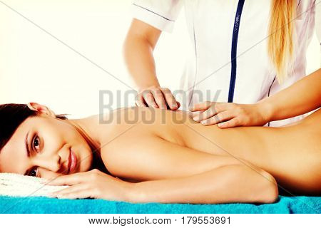 Woman having massage of body in the spa salon. Beauty treatment concept.