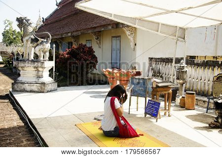 Asian Thai Woman People Respect Praying Buddha Statue And Chedi At Wat Phra That Chom Ping