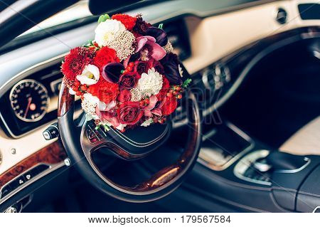 Wedding Bouquet In The Wheel Of A Car