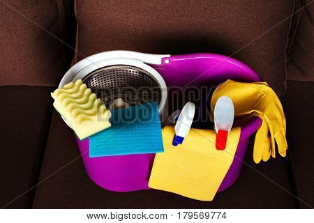 Cleaning servisce supplies in a busket, closeup
