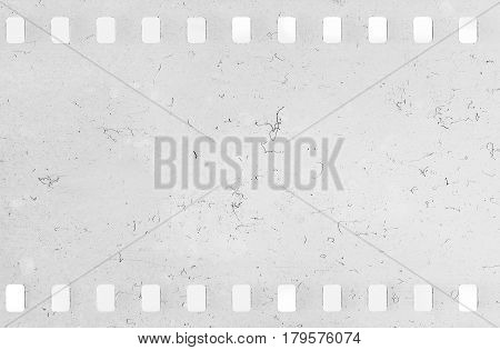Strip of old celluloid film with dust and scratches - light