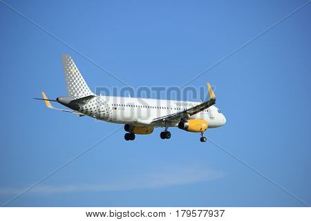 Amsterdam the Netherlands - July 15th 2016: EC-LZE Vueling Airbus A320 approaching Polderbaan runway at Schiphol Amsterdam Airport arriving from Barcelona Spain