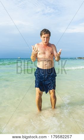mature man enjoys the beautiful sandy beach