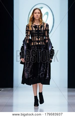 MOSCOW RUSSIA - MARCH 21 2017: Model walk runway for VALENTIN YUDASHKIN catwalk at Autumn-Winter 2017-2018 Moscow Fashion Week.