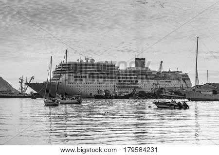 Victoria Mahe Island Seychelles - December 152015: Costa Neoromantica Cruise ship anchored at Victoria port Mahe Island Seychelles. Black and white photography.