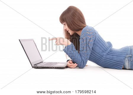 Young woman lying on floor using laptop. Young caucasian woman lying down isolated on white background.