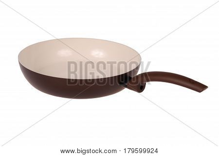 Photo of brown ceramic frying pan isolated on white background with soft shadow. Clipping path