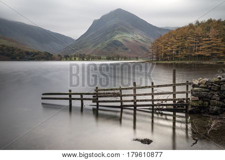 Stuning Autumn Fall Landscape Image Of Lake Buttermere In Lake District England