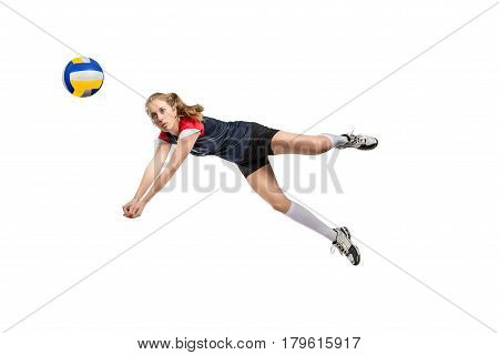 Female volleyball player jumping for the hard ball isolated on white background