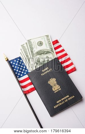 concept showing Indian passport with US currency notes or Dollars with american flag in the background, applying for US / american tourist or H-1B visa