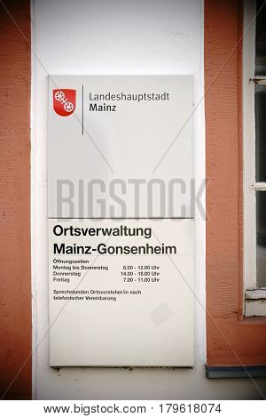 MAINZ, GERMANY - MARCH 22: The entrance sign of the city administration in Mainz Gonsenheim with the opening hours on March 22 2017 in Mainz.