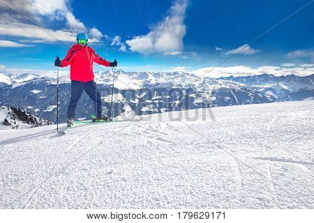 Man Skiing On The Prepared Slope With Fresh New Powder Snow In Alps