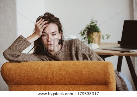 indoor portrait of beautiful feminine thoughtful young women alone in the room.