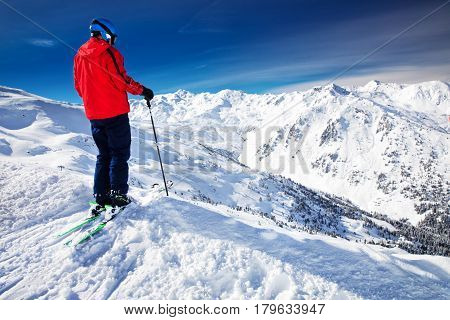 Man Enjoying The Stunning View Before Freeride Skiing In Famous Ski Resort In Alps