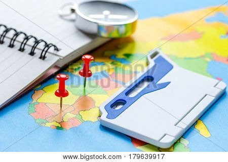 preparetion and booking travel concept with compass on map of the world background