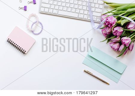 Trendy spring design of office workdesk with blossom on white background top view mock-up