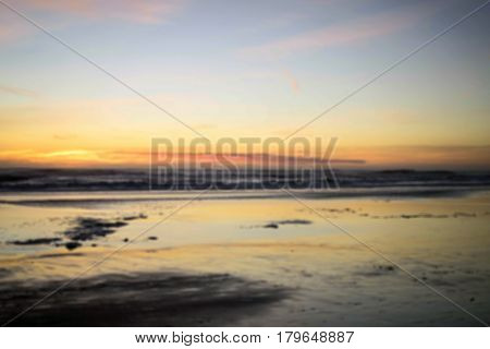 Ocean beach sunset in blurred for background