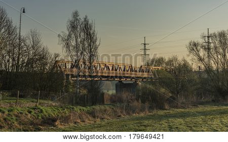 Railway track and bridge in Bakov nad Jizerou area with sunrise