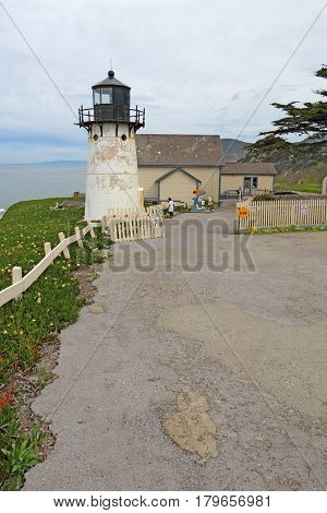 MONTARA CALIFORNIA - MARCH 16 2015: Lighthouse displays and entrance to the Point Montara Lighthouse Hostel off of California Highway 1 approximately 25 miles south of San Francisco on a cloudy day.