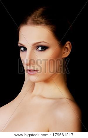 Attractive blonde topless woman with dark make up