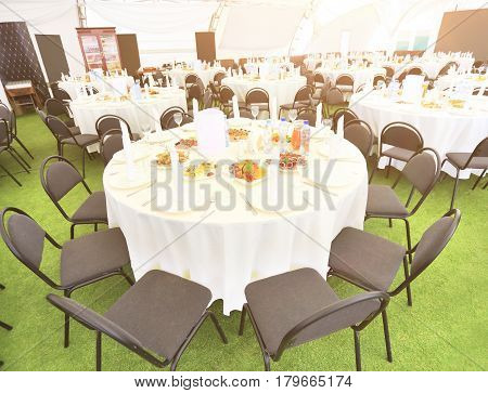 Magnificent stool for a holiday and table setting for a gourmet kitchen in the open air