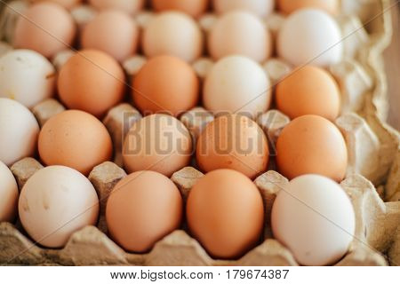 Close Up Of  Eggs In A Basket. Top View Of Eggs In Bowl. Brown E