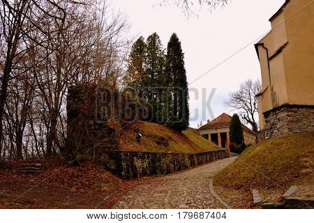 Courtyard Of The Old Medieval Saxon Lutheran Church In Sighisoara, Transylvania, Romania