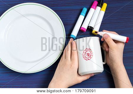 Handmade colorful painting on crockery markers for ceramics. Children's art project craft for children. DIY concept. Step-by-step photo instructions. 