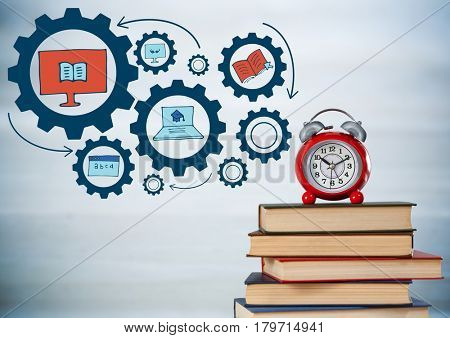 Digital composite of Pile of books and clock with blue gear graphics against blurry grey wood panel