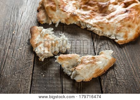 Traditional asian bread. Flatbread on wooden background